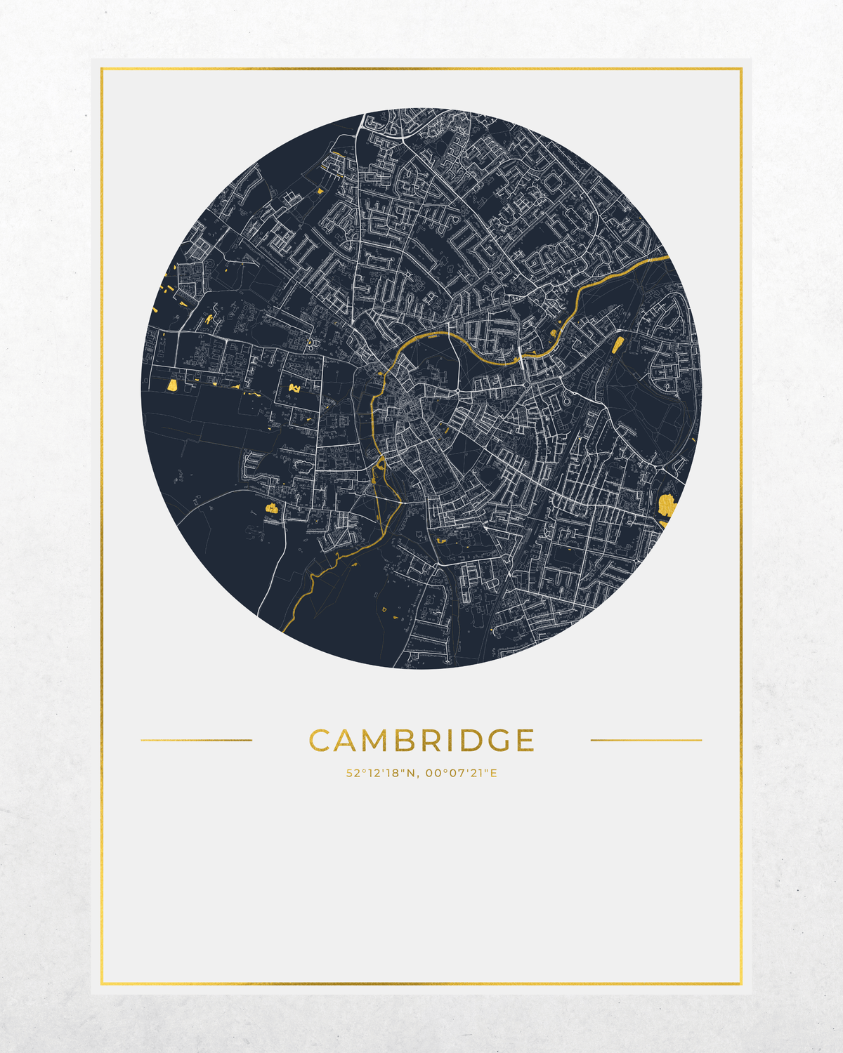 A minimalist city map print of Cambridge, featuring a circular dark navy street map with gold lines and text, centered on a light off-white background with a thin gold border.