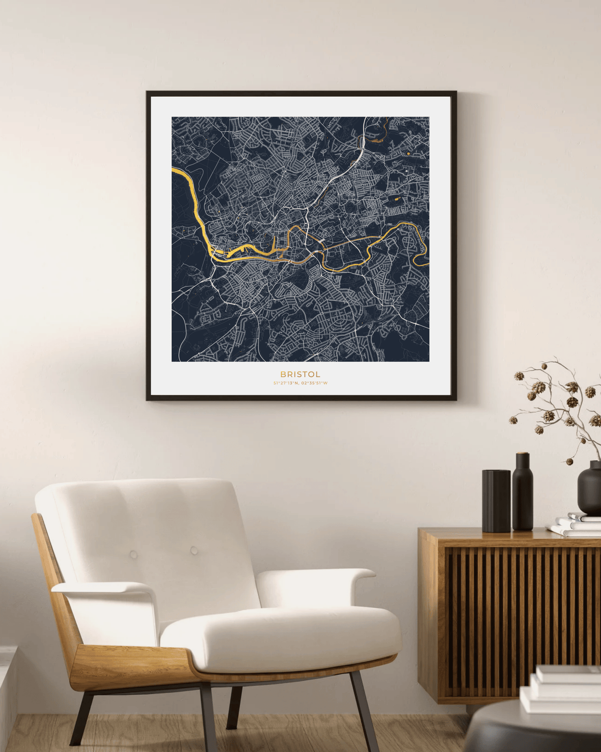 A framed art print of a street map of Sofia, Bulgaria, featuring a dark navy blue background, white street lines, and a gold river, displayed on a beige wall in a modern living room setting.