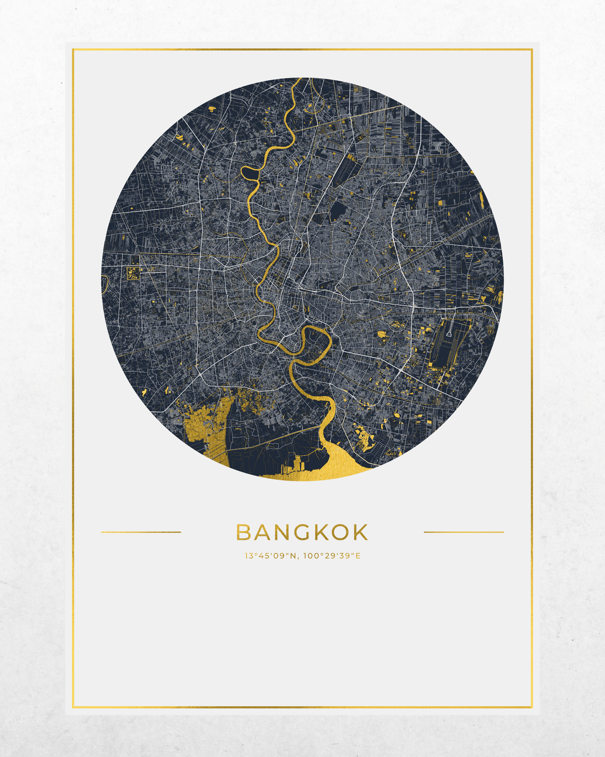 A minimalist circular map print of Bangkok, featuring a dark navy blue city layout with gold lines and highlights, set against a light off-white background with a thin gold border and the city name 'BANGKOK' printed below.