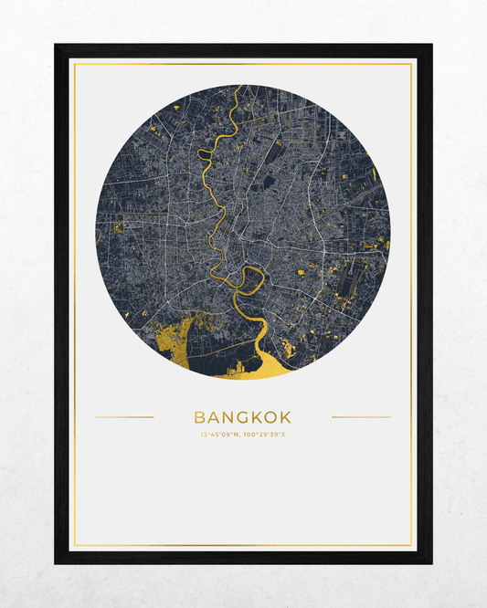 A framed circular map print of Bangkok, featuring a dark gray street grid with bright yellow gold and the city name printed below, shown against a light textured background.
