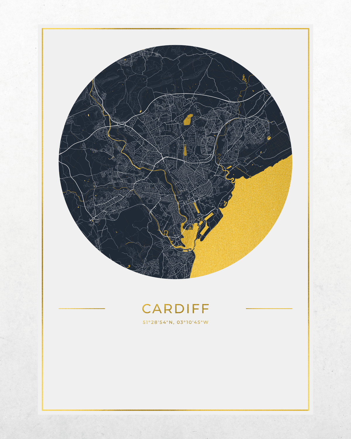 A minimalist city map print of Cardiff, Wales, featuring a circular design with a dark navy blue background, a bright gold textured section, and fine white street lines. The word 'CARDIFF' and coordinates are printed below the map on a light off-white background with a thin gold border.