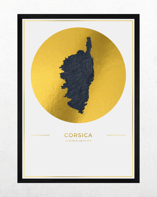 A framed art print featuring a textured dark blue map silhouette of Corsica centered within a large gold circle on a white background, with the word 'CORSICA' and small coordinates printed below. The print is housed in a black frame with a white mat.