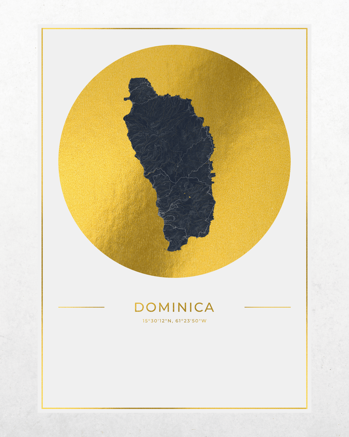A minimalist map art print of Dominica, featuring a dark charcoal gray silhouette of the island centered inside a textured gold circle, with the name 'DOMINICA' and coordinates printed below on a white background with a thin gold border.
