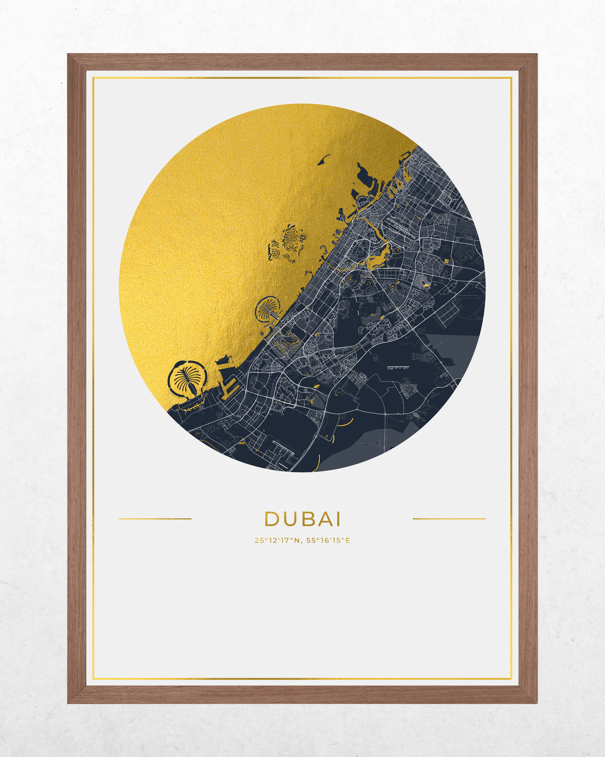 A framed Dubai map art print featuring a circular design with a gold metallic-textured left half and a dark navy right half, with 'DUBAI' and coordinates printed below, shown in a brown wood frame against a light textured wall.