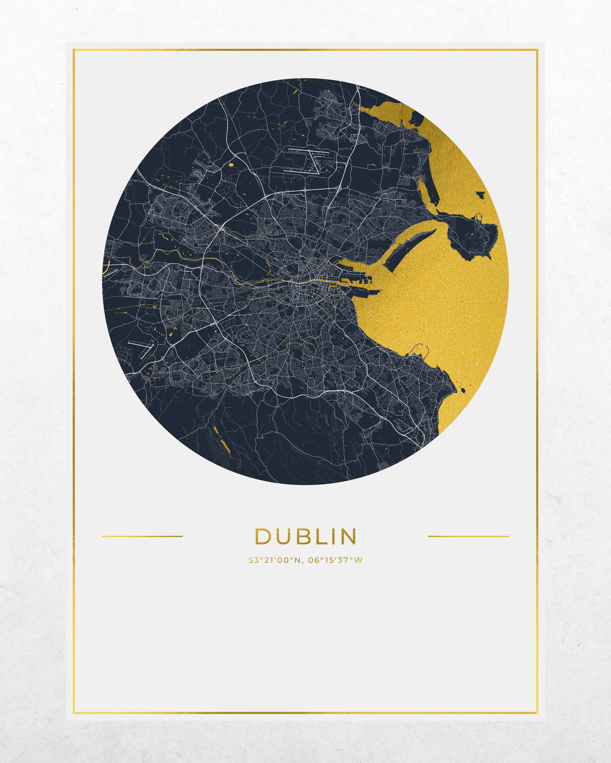 A minimalist Dublin city map art print featuring a circular map design in dark navy and gold, with the city name 'DUBLIN' and coordinates printed below, set against a light textured background.