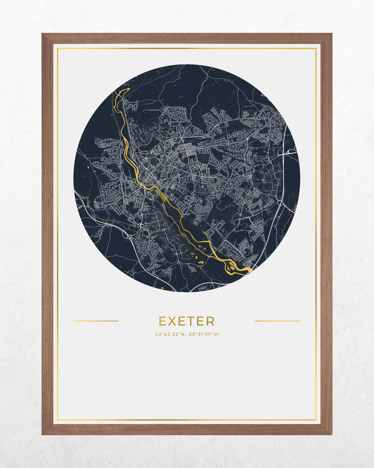 A framed circular map print of Exeter, UK, featuring a dark navy blue map with white street details and a highlighted gold river running through the center, set in a light brown wood frame with a white mat.