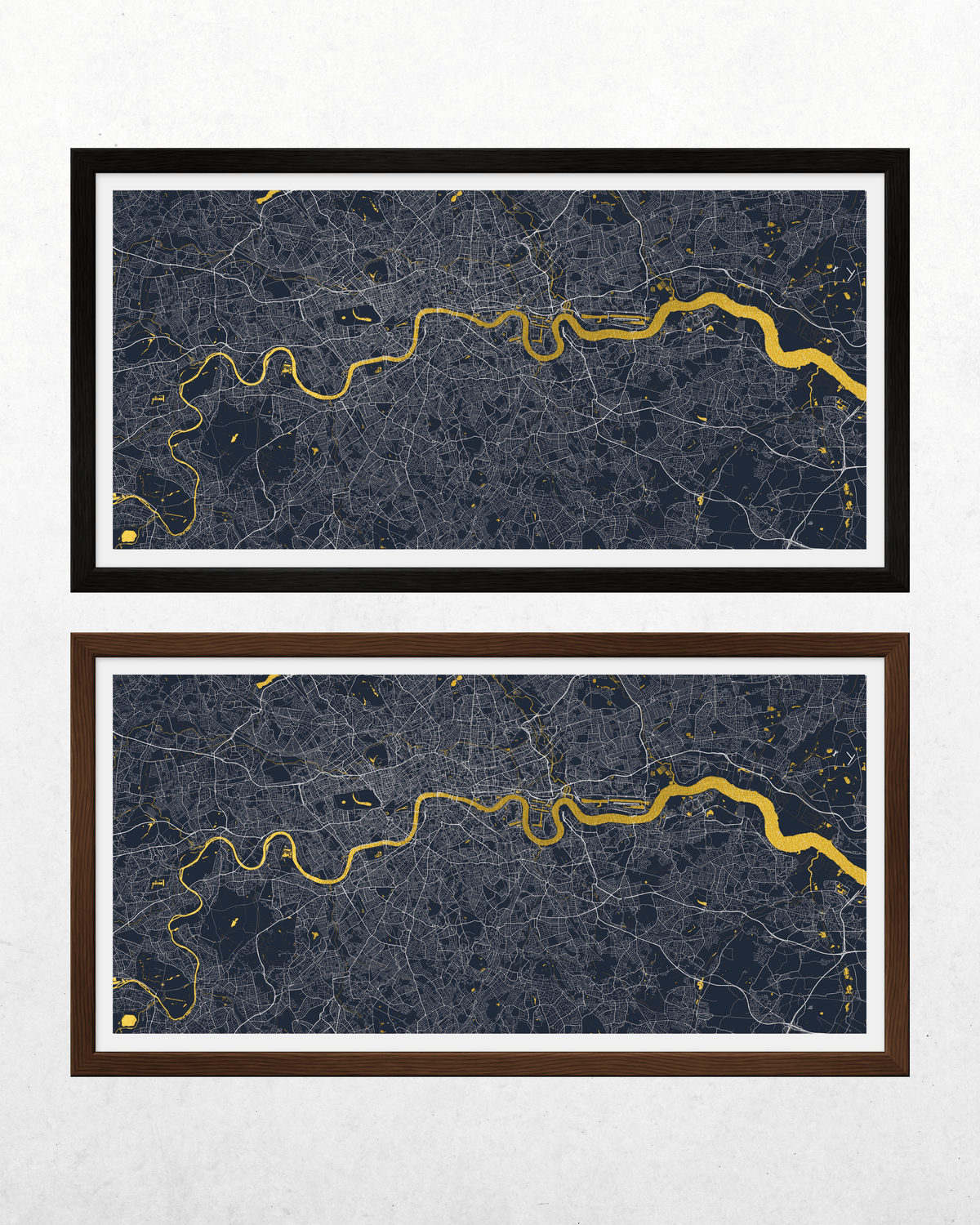 Two framed city map wall art prints are shown on a light textured background. The top print has a black frame with a white border and a dark blue and gold map.