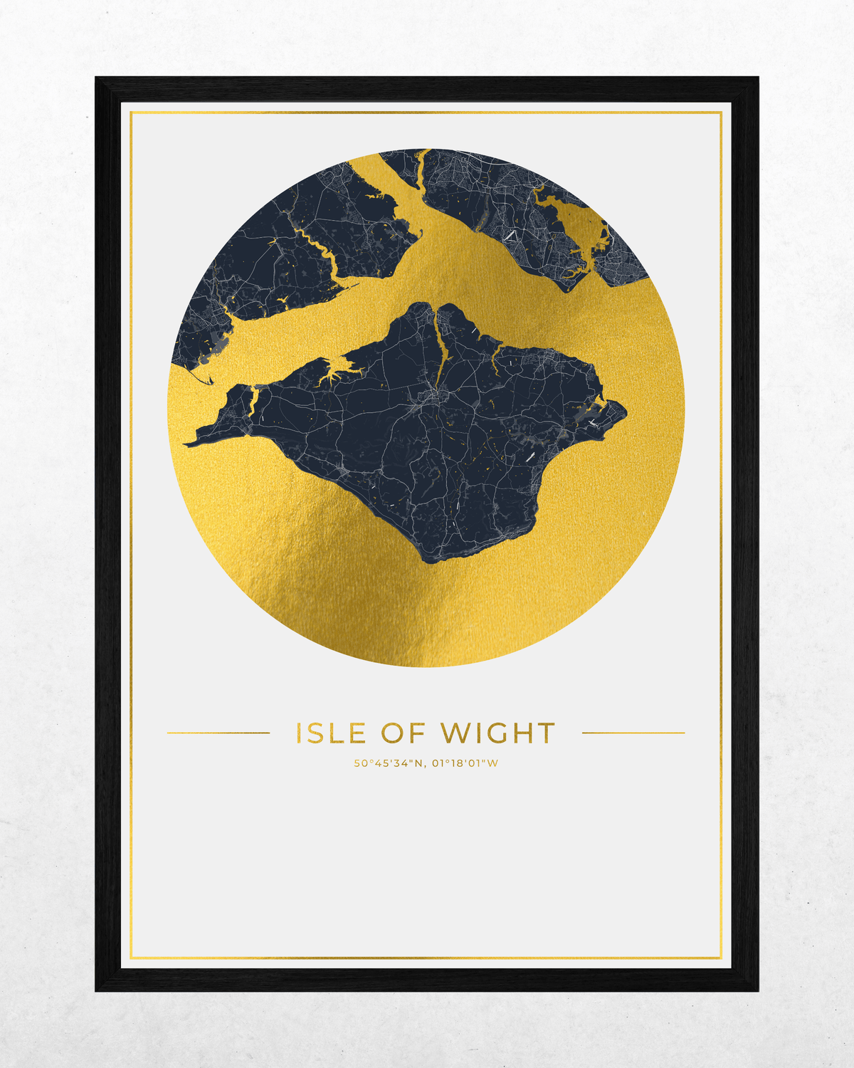 A framed art print featuring a stylized map of the Isle of Wight in dark navy blue with gold city outlines, set against a large gold circular backdrop. The print is titled 'ISLE OF WIGHT' with coordinates below, presented in a black frame on a light textured background.