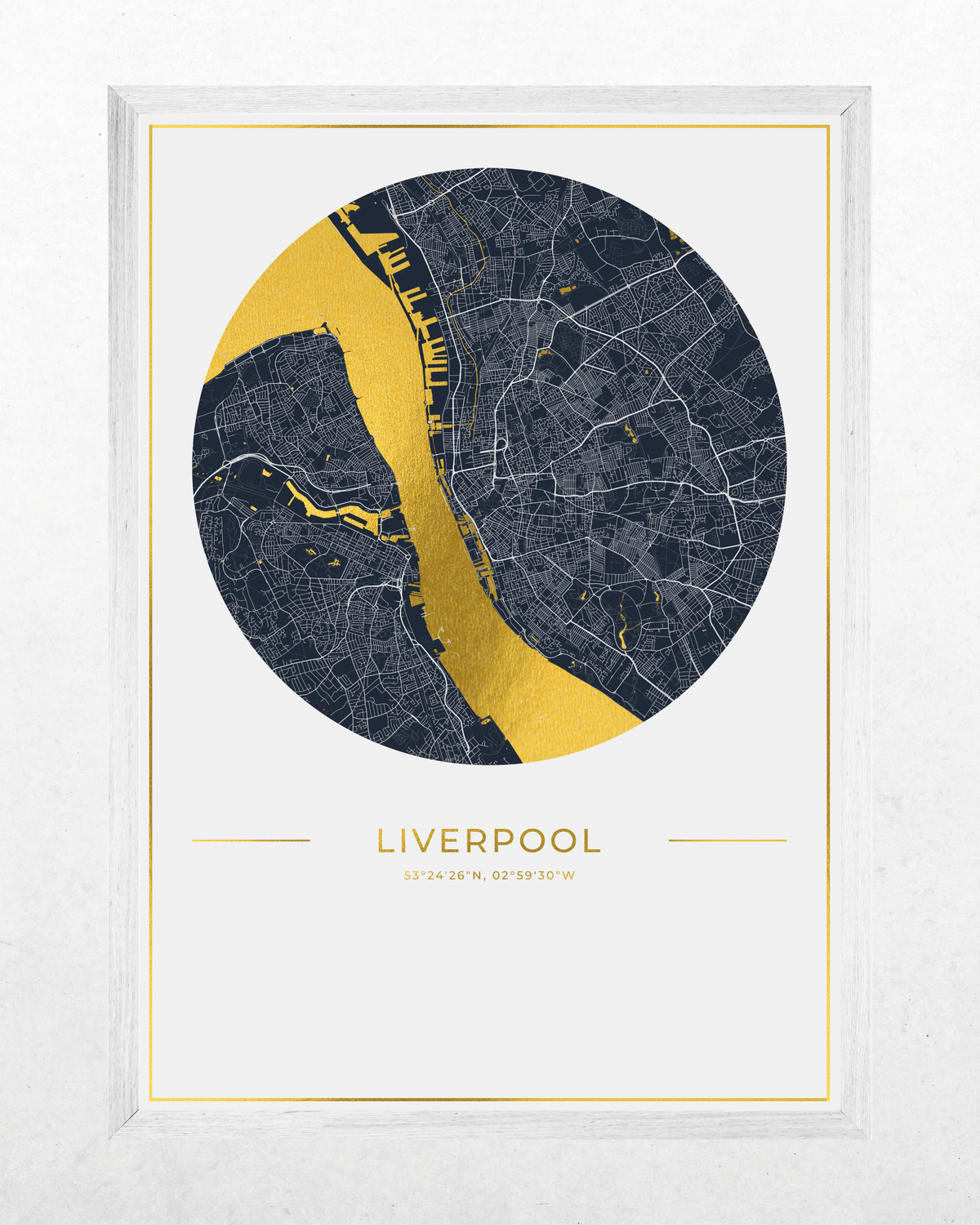 A framed circular map print of Liverpool, featuring a dark navy street grid with a bold metallic gold river cutting through the center, plus gold text reading 'LIVERPOOL' and coordinates below. The print is set within a white frame against a light textured background.