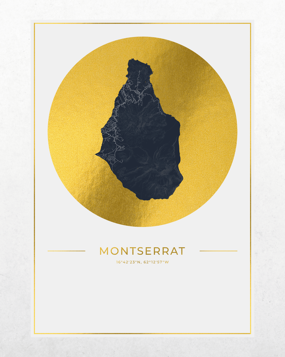 A minimalist art print of Montserrat, featuring a dark navy blue silhouette map of the island set against a textured gold circular background, with the name 'Montserrat' and coordinates printed below, all framed within a thin gold border on a light gray background.