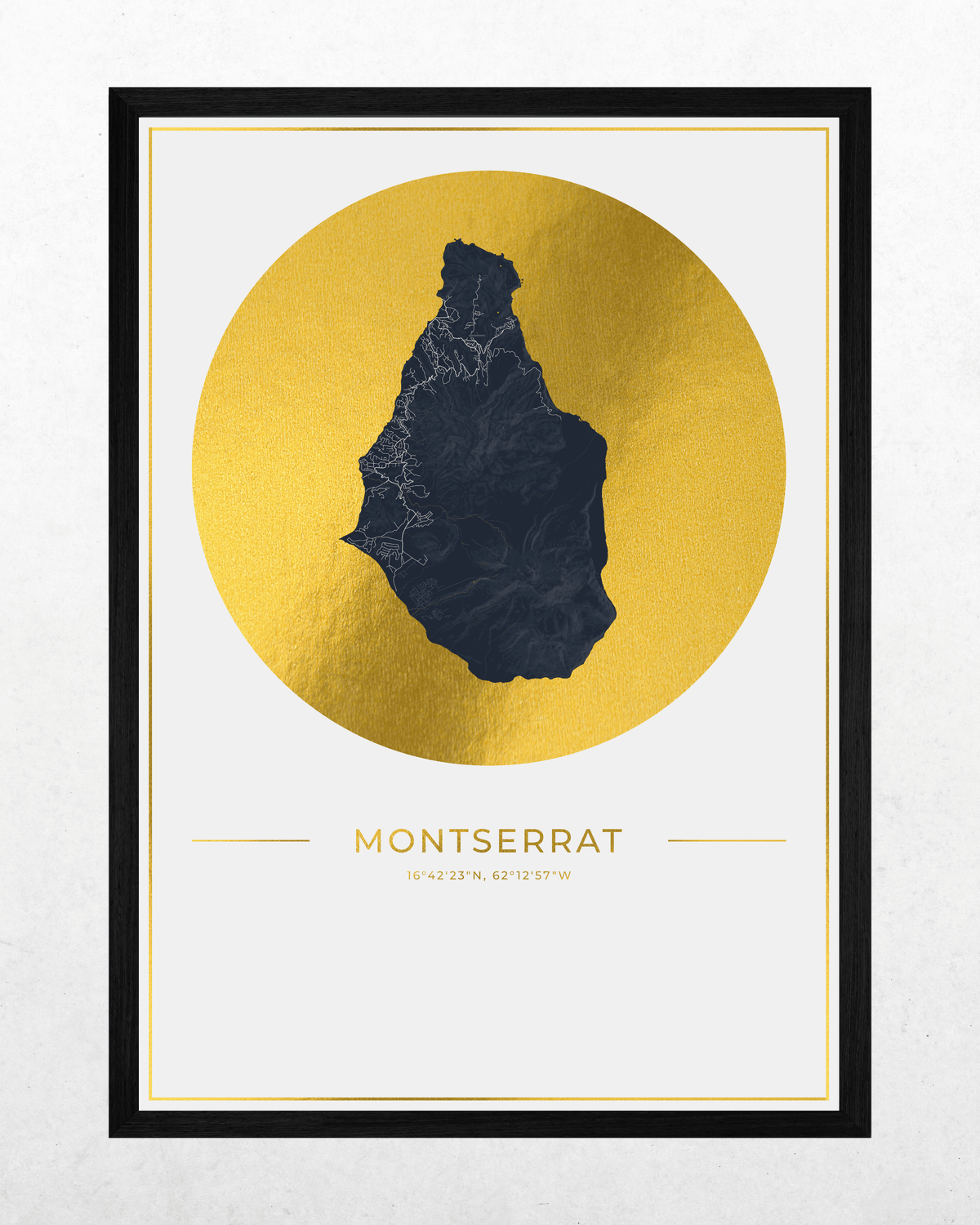 A framed minimalist map art print of Montserrat, featuring a dark navy blue silhouette of the island on a textured gold circular background, with the name 'MONTSERRAT' and coordinates printed below, all set within a black frame.