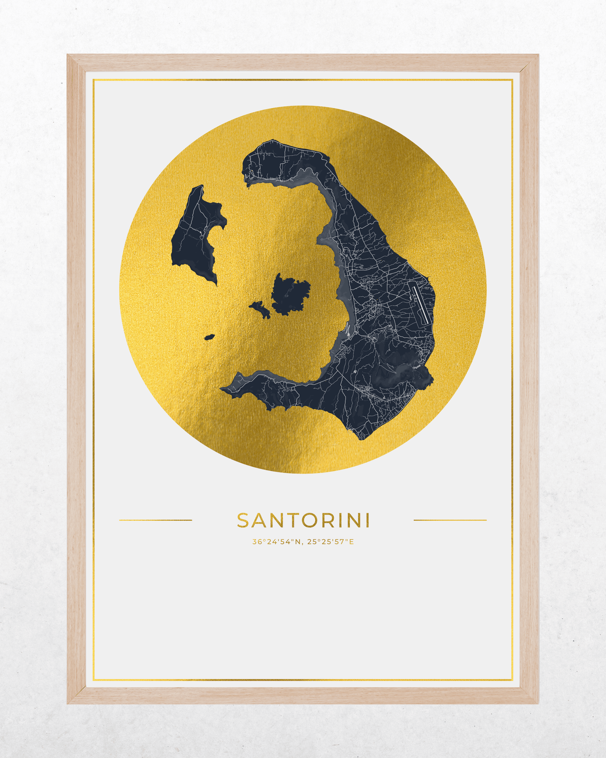 A framed minimalist art print of Santorini, Greece. The design features a dark navy blue map of the island set against a large textured gold circle, with the name 'SANTORINI' and coordinates printed below.