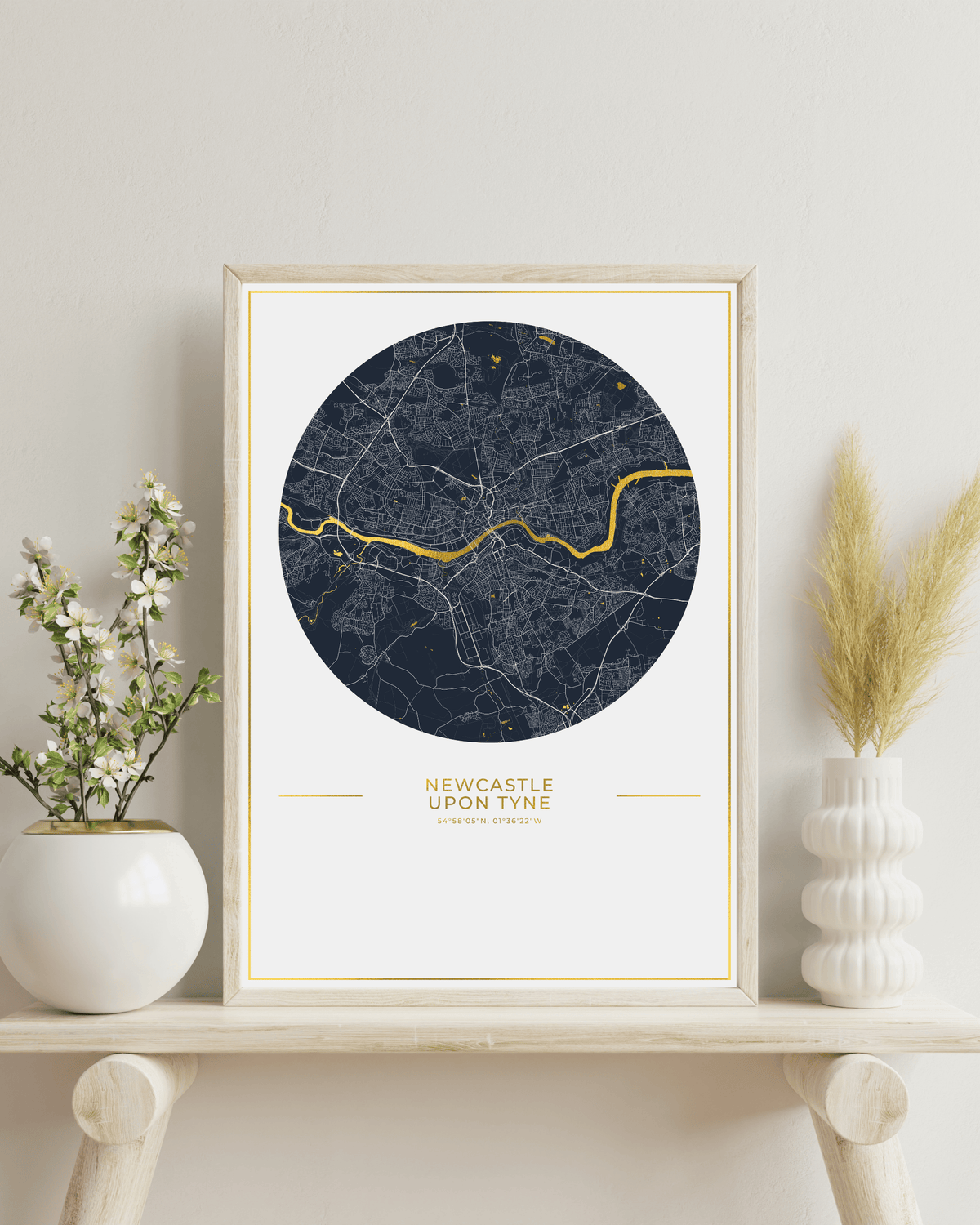 Newcastle upon Tyne gold foil map in a natural wood frame.