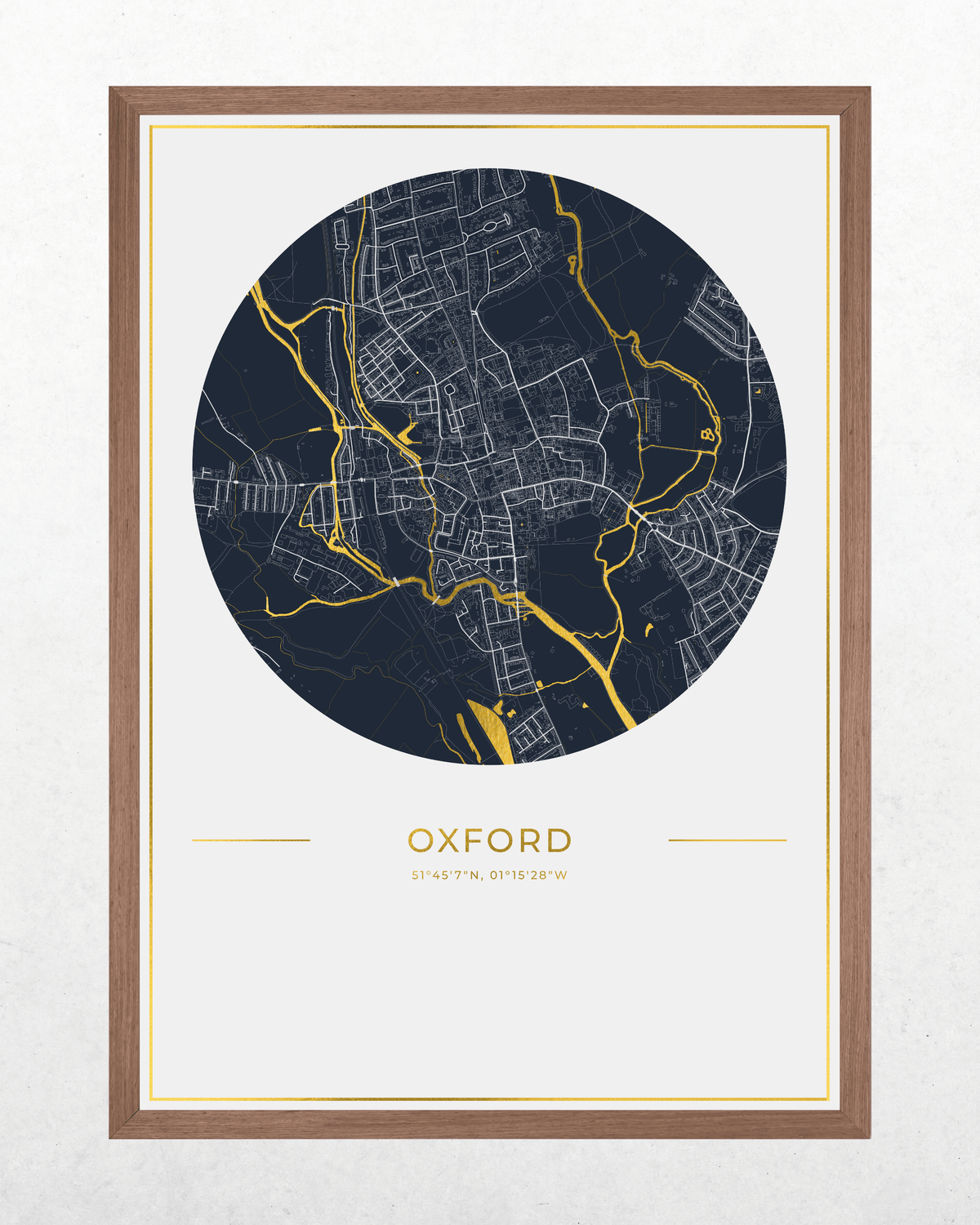 A framed circular map print of Oxford, featuring a dark navy street network with bright gold river highlights on a white mat, enclosed in a warm brown wood frame.