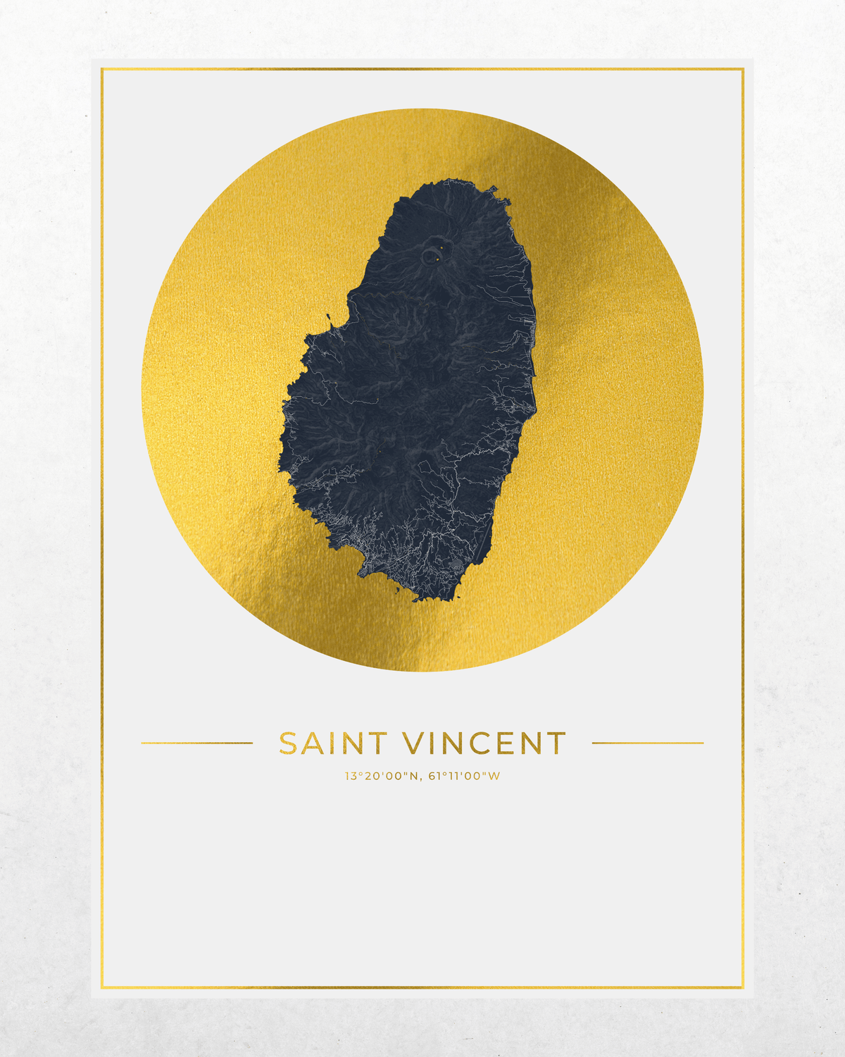 Saint Vincent map art print featuring a dark blue island silhouette centered within a large textured gold circle on a white background, with 'SAINT VINCENT' printed below in gold. The print photographed against a light gray wall.