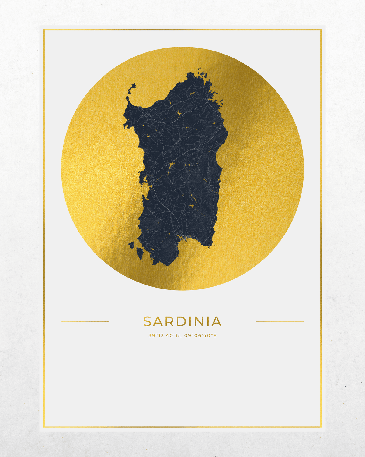 A minimalist art print of Sardinia's map, featuring a dark navy blue silhouette of the island set against a textured gold circular background, with the name 'SARDINIA' and coordinates printed below on a white card with a gold border.