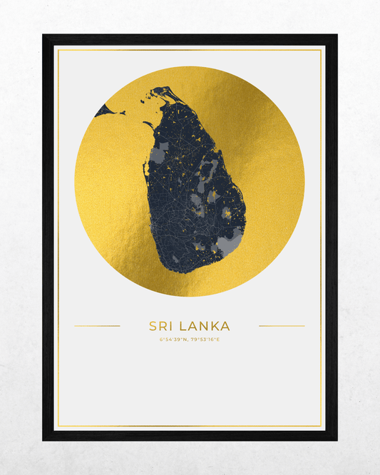 A framed minimalist map print of Sri Lanka, featuring a textured gold circular background with a dark navy map silhouette in the center, and the text 'SRI LANKA' below, presented in a black frame against a light textured wall.