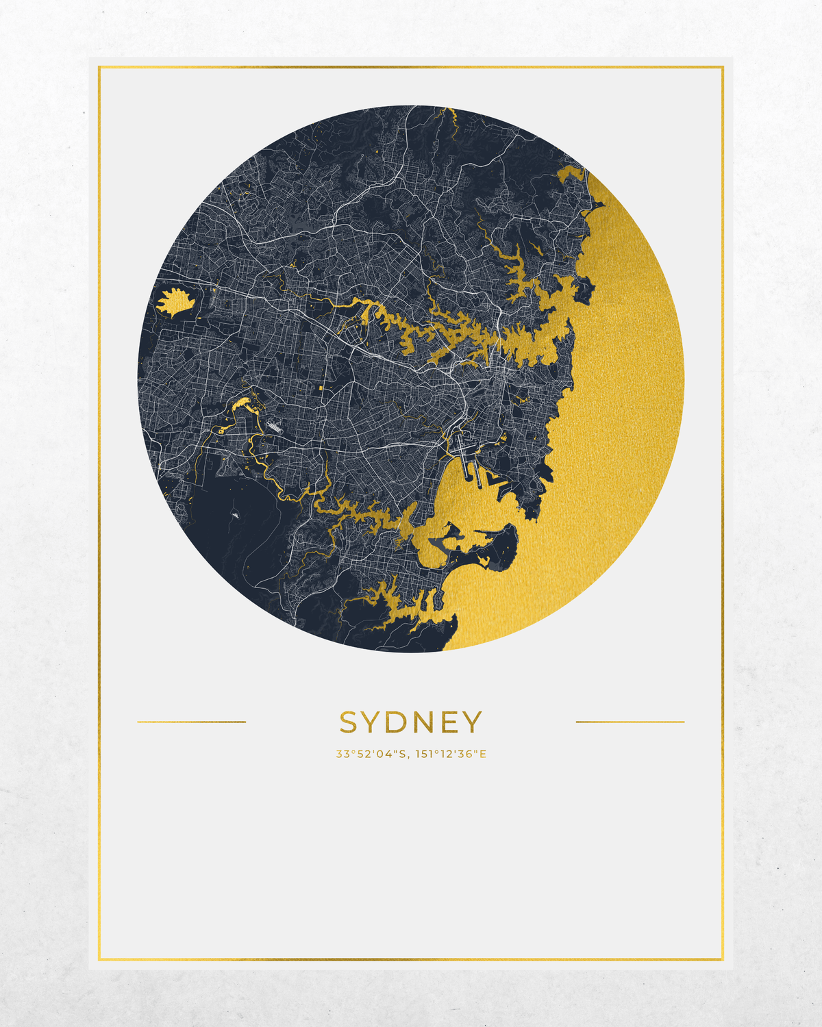 A minimalist circular map print of Sydney, Australia, featuring a dark navy cityscape and gold water areas, framed by a thin gold border on a white background with the word 'SYDNEY' and coordinates below.