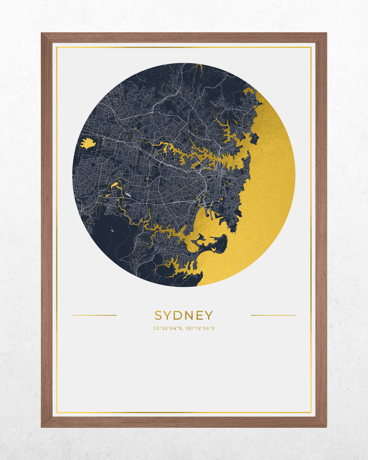 Framed Sydney city map art print with a circular dark navy and gold map design, the word SYDNEY below, and a brown wood frame on a light textured background.