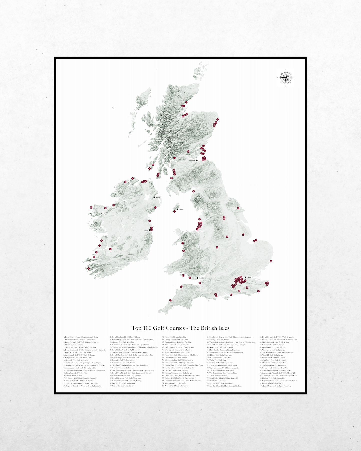 A framed map print of the United Kingdom titled 'Top 100 Golf Courses - The British Isles' on a light textured background.