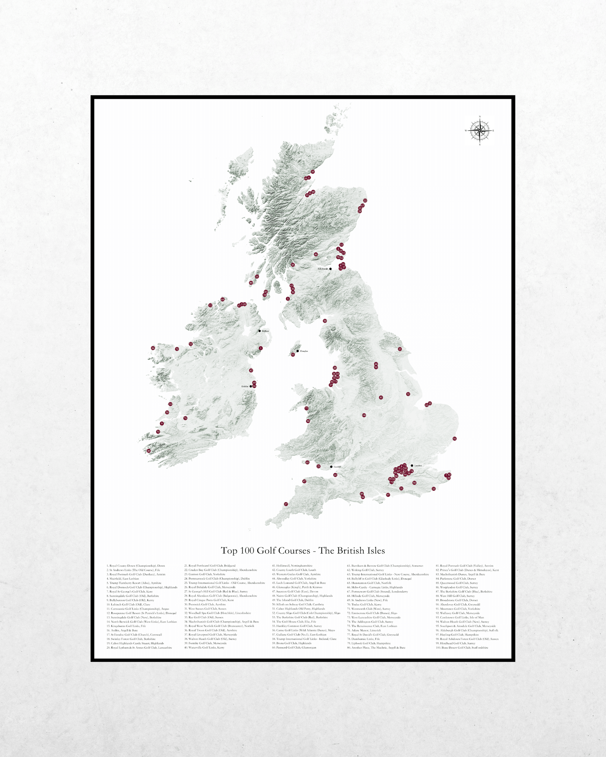 A framed map print of the United Kingdom titled 'Top 100 Golf Courses - The British Isles' on a light textured background.